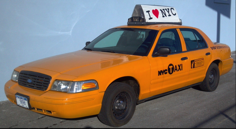 Ford Crown Victoria NYC taxi with I Love NYC rooftop ad sign