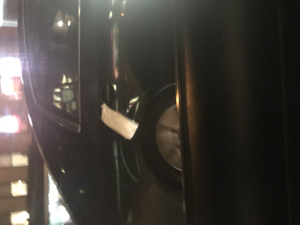 Dark close-up photo of a car door
